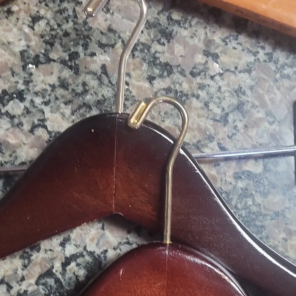 Lot of 4 wooden hangers with pant clips good condition small hook